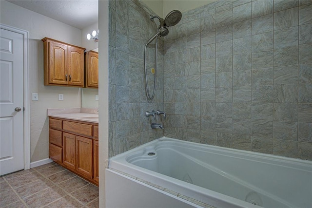 bathroom with tiled shower / bath and vanity