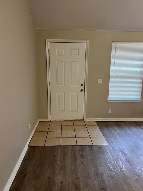 foyer entrance with hardwood / wood-style flooring