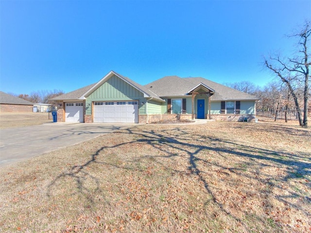 view of front of property with an attached garage, brick siding, board and batten siding, and concrete driveway