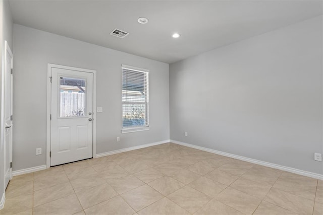 empty room with light tile patterned floors