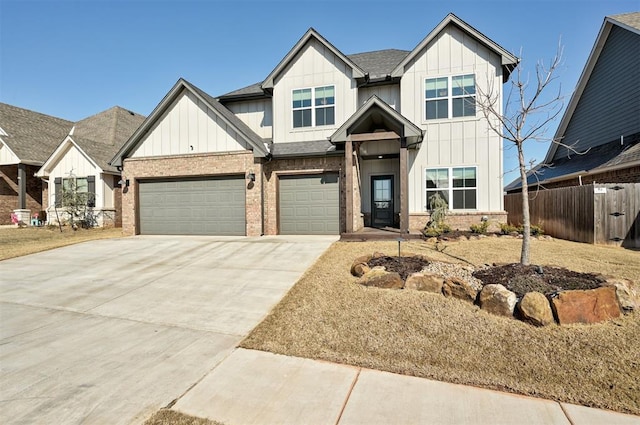 view of front of home featuring fence, driveway, brick siding, a shingled roof, and board and batten siding