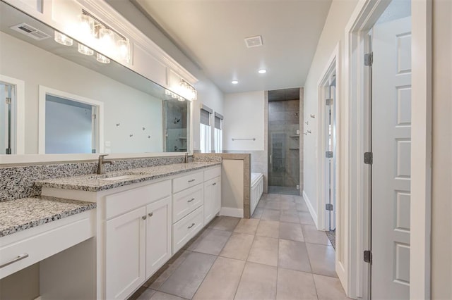 bathroom with vanity, shower with separate bathtub, and tile patterned floors