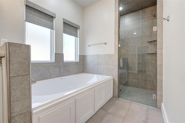 bathroom featuring independent shower and bath and tile patterned flooring