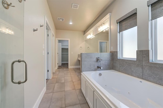 bathroom with tile patterned floors, plus walk in shower, and vanity