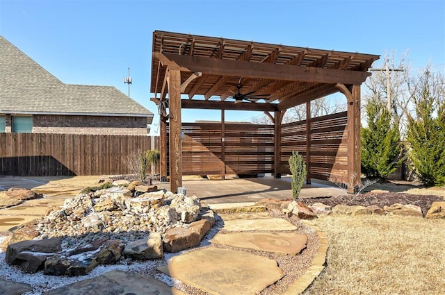 view of patio / terrace with ceiling fan and a pergola