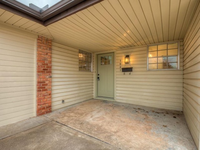 property entrance with a patio