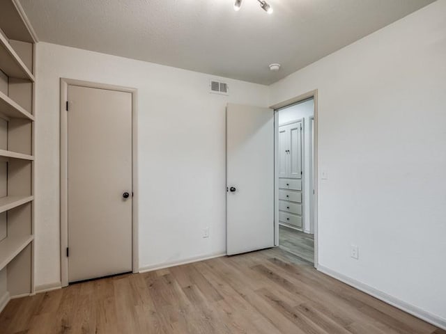 unfurnished bedroom featuring light hardwood / wood-style flooring