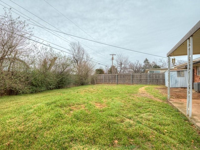 view of yard featuring central AC unit