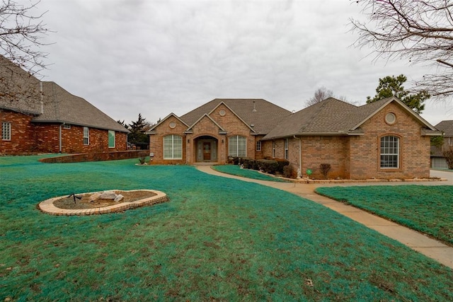 rear view of property with a yard