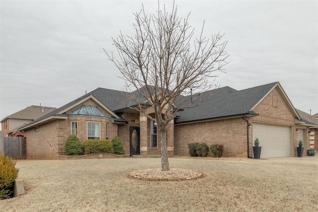 single story home with a garage and a front yard