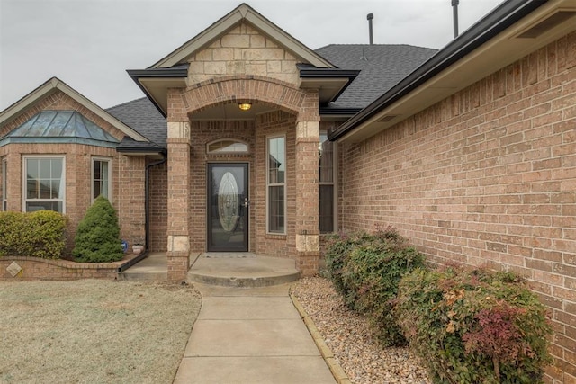 entrance to property with a yard