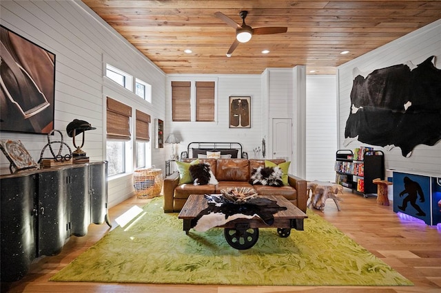 living room with wooden ceiling, wood walls, wood finished floors, a ceiling fan, and recessed lighting