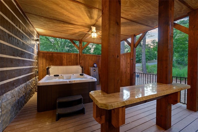 deck featuring a hot tub