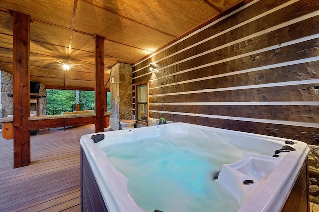 deck featuring an indoor hot tub