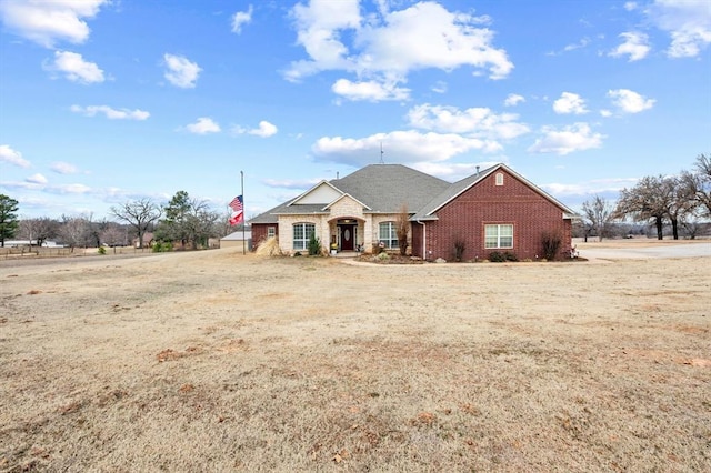 ranch-style home with a front yard