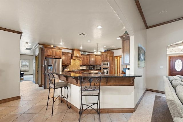 329826 E Hwy 66, Wellston, OK 74881 - kitchen with stainless steel appliances, crown molding, a kitchen bar, baseboards, and tasteful backsplash