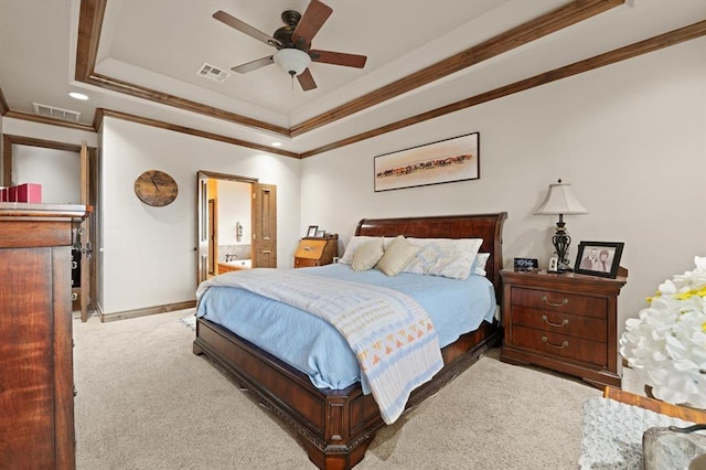329826 E Hwy 66, Wellston, OK 74881 - carpeted bedroom featuring a raised ceiling, crown molding, baseboards, a ceiling fan, and ensuite bath
