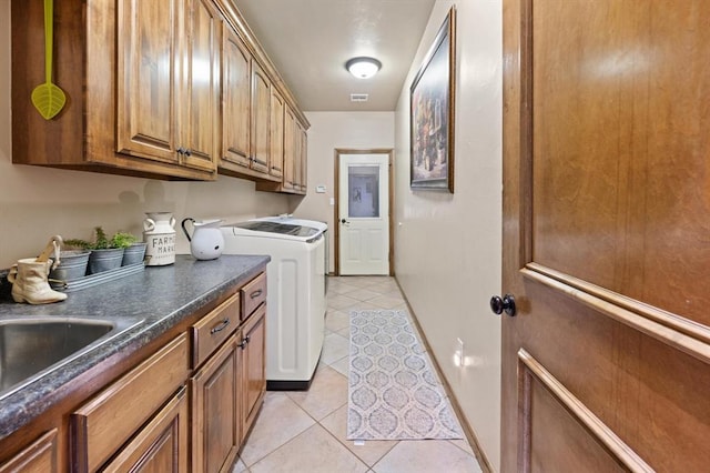 329826 E Hwy 66, Wellston, OK 74881 - washroom with washing machine and dryer, cabinet space, and light tile patterned flooring