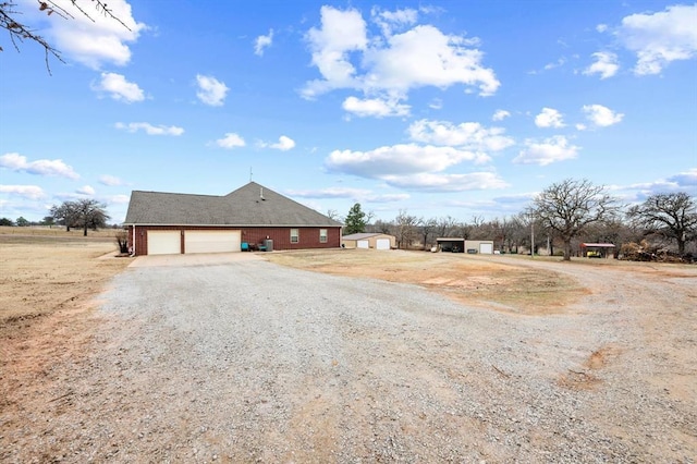329826 E Hwy 66, Wellston, OK 74881 - view of side of home featuring driveway and an attached garage
