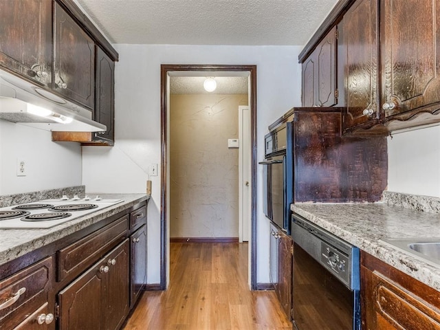 kitchen featuring dark brown cabinetry, wall oven, dishwasher, and white electric stovetop