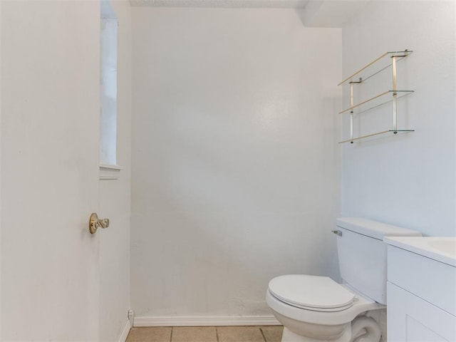 bathroom with tile patterned floors, toilet, and vanity