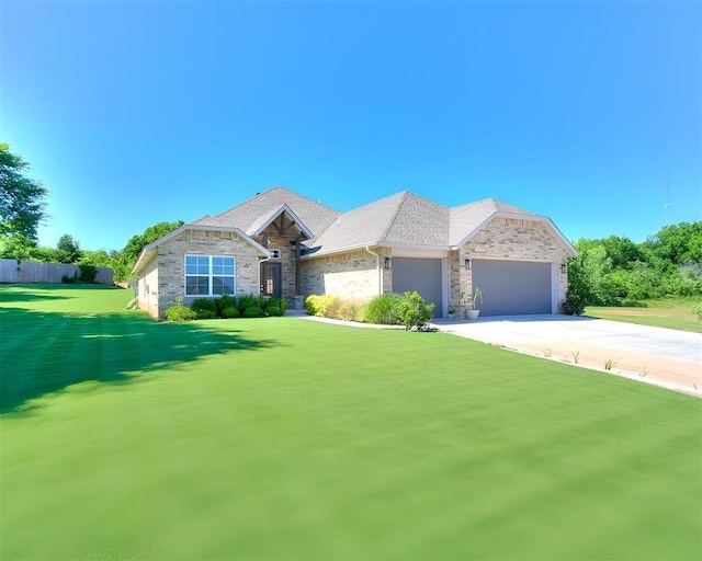 3683 King Arthur Ct, Newcastle, OK 73065 - view of front facade featuring an attached garage, stone siding, and concrete driveway