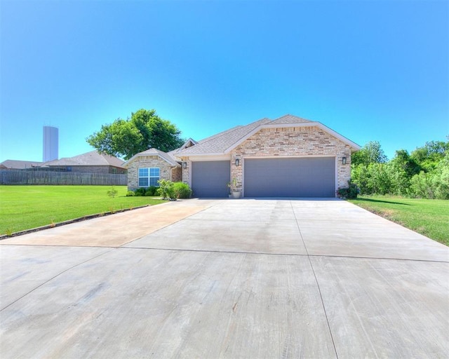 3683 King Arthur Ct, Newcastle, OK 73065 - ranch-style house with concrete driveway, an attached garage, and stone siding