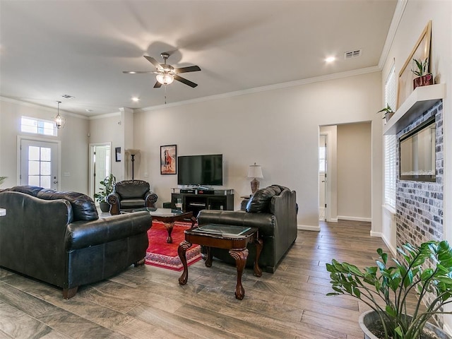 3683 King Arthur Ct, Newcastle, OK 73065 - living room with ceiling fan, wood finished floors, baseboards, crown molding, and recessed lighting