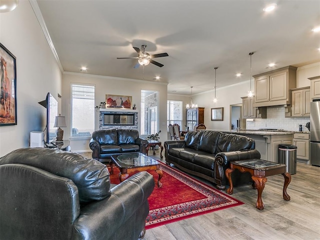 3683 King Arthur Ct, Newcastle, OK 73065 - living room with crown molding, healthy amount of natural light, ceiling fan, light wood-style flooring, and recessed lighting