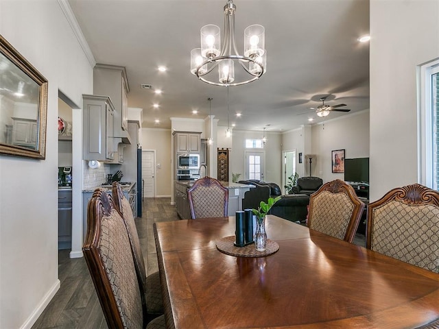 3683 King Arthur Ct, Newcastle, OK 73065 - dining space with crown molding, a chandelier, baseboards, a ceiling fan, and recessed lighting
