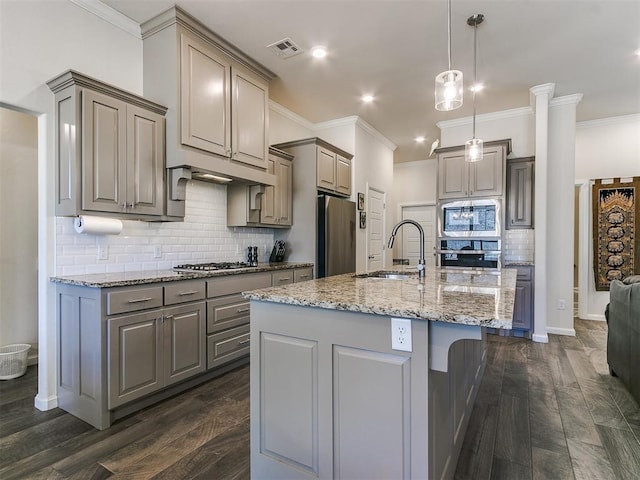 3683 King Arthur Ct, Newcastle, OK 73065 - kitchen with gray cabinetry, appliances with stainless steel finishes, a sink, crown molding, and tasteful backsplash