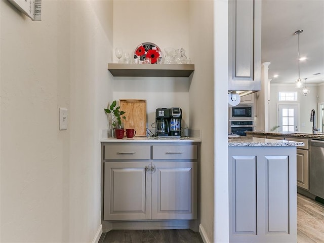 3683 King Arthur Ct, Newcastle, OK 73065 - kitchen featuring stainless steel appliances, open shelves, gray cabinetry, a peninsula, and wood finished floors
