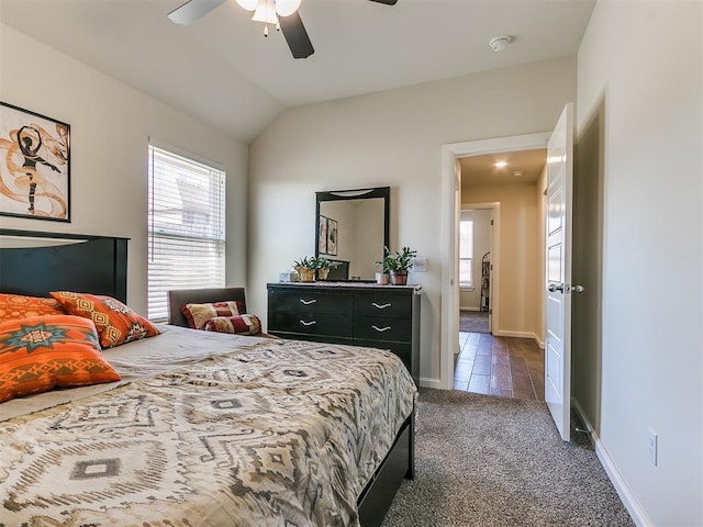 3683 King Arthur Ct, Newcastle, OK 73065 - bedroom with dark colored carpet, ceiling fan, baseboards, and vaulted ceiling
