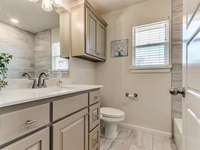 3683 King Arthur Ct, Newcastle, OK 73065 - full bathroom featuring vanity, toilet, baseboards, and marble look tile flooring