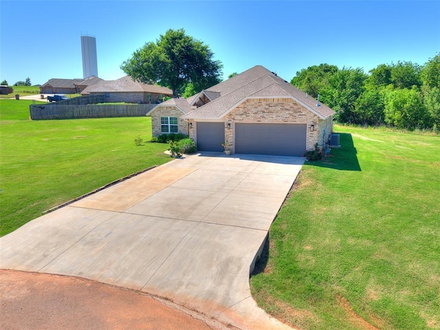 3683 King Arthur Ct, Newcastle, OK 73065 - view of front of home with an attached garage, concrete driveway, and stone siding