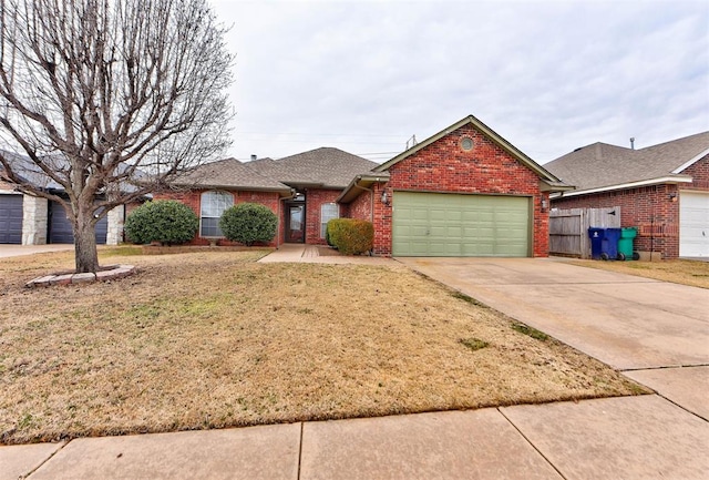 ranch-style house with a garage and a front lawn