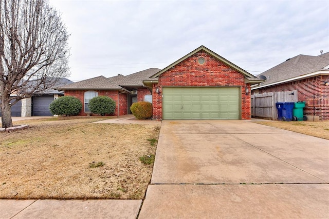 ranch-style home featuring a garage and a front lawn