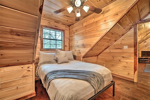 bedroom featuring ceiling fan, wood ceiling, dark hardwood / wood-style flooring, and wood walls