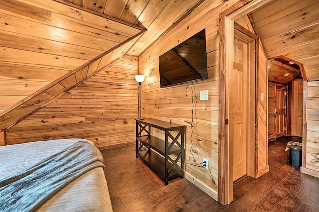 bedroom with wooden ceiling, dark hardwood / wood-style flooring, and wood walls