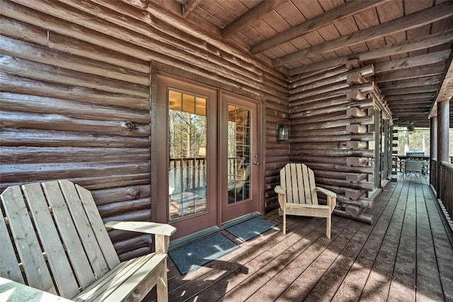 wooden deck featuring french doors