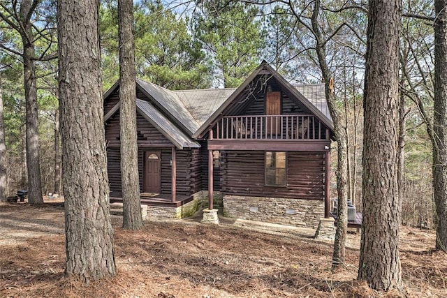 log-style house featuring central AC unit