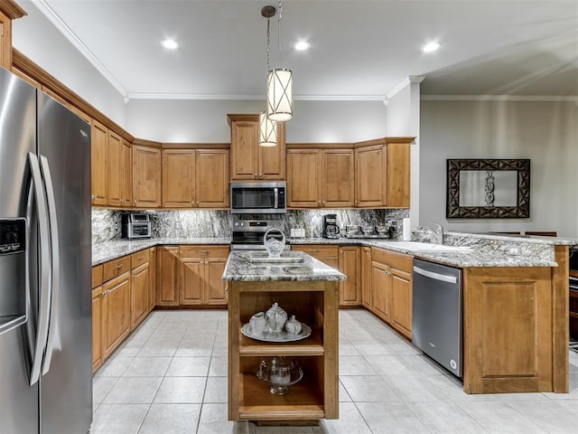 kitchen featuring hanging light fixtures, a kitchen island with sink, light stone counters, kitchen peninsula, and stainless steel appliances