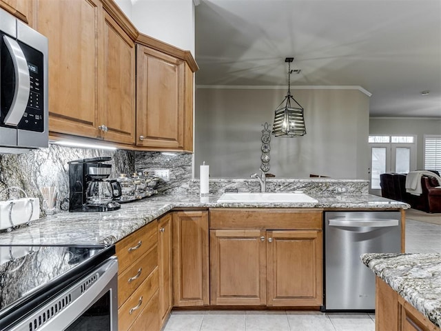 kitchen with tasteful backsplash, sink, light stone counters, stainless steel appliances, and crown molding