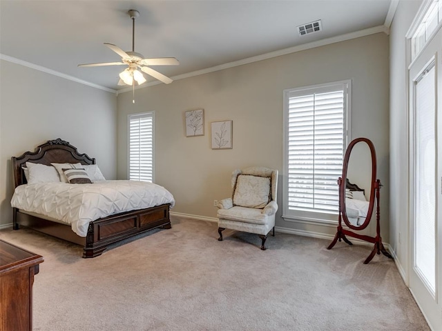 carpeted bedroom featuring multiple windows, ornamental molding, and ceiling fan