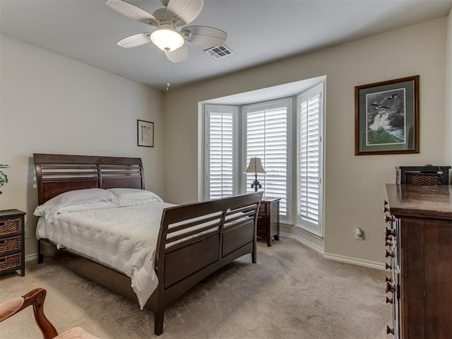 bedroom with light colored carpet and ceiling fan