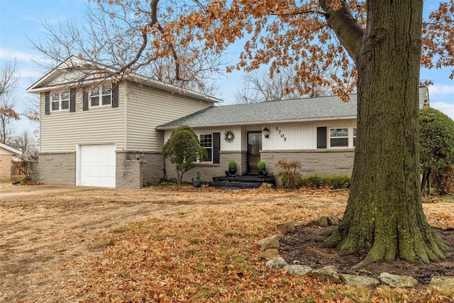 split level home featuring a garage