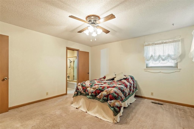 bedroom with light carpet, connected bathroom, a textured ceiling, and ceiling fan