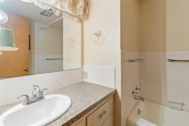 bathroom featuring vanity and bathtub / shower combination