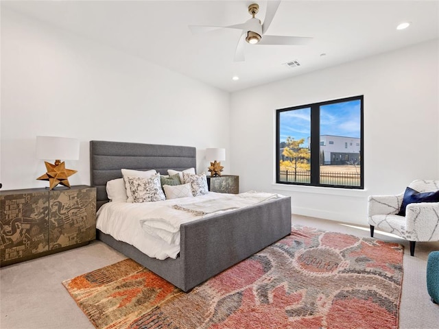 carpeted bedroom featuring a ceiling fan, visible vents, and recessed lighting