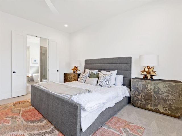 carpeted bedroom featuring connected bathroom and recessed lighting